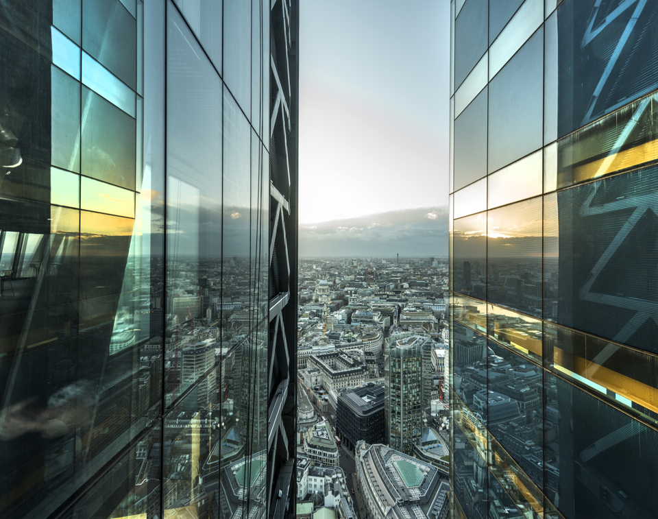 Aerial of city with glass building